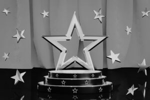 Star trophy representing Bellastrega’s Business Insider feature and 2025 Global Recognition Award.